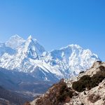 Himalayan mountains with a hiker trekking in Nepal
